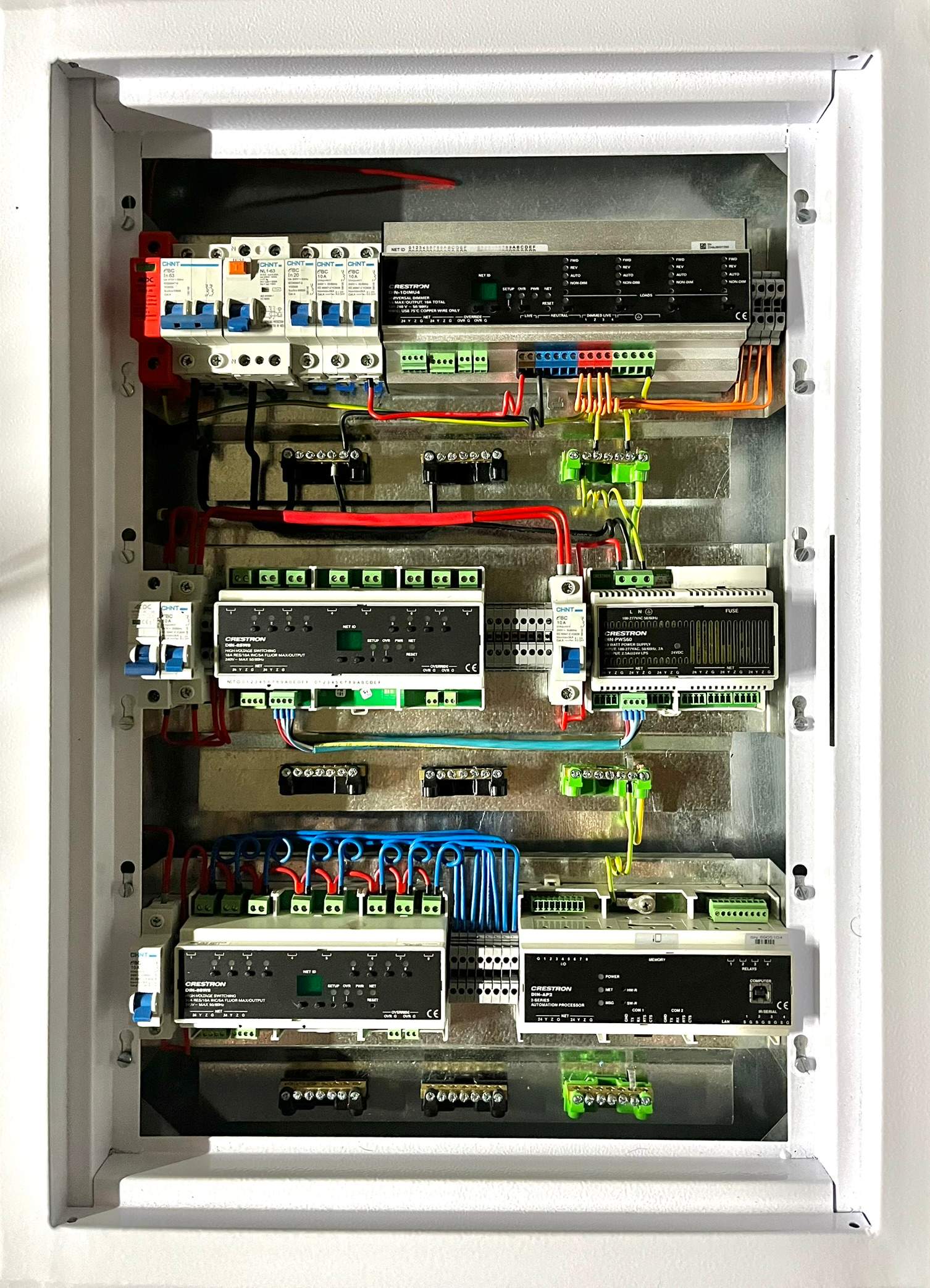 Crestron lighting-control distribution board with organised relay and wiring layout