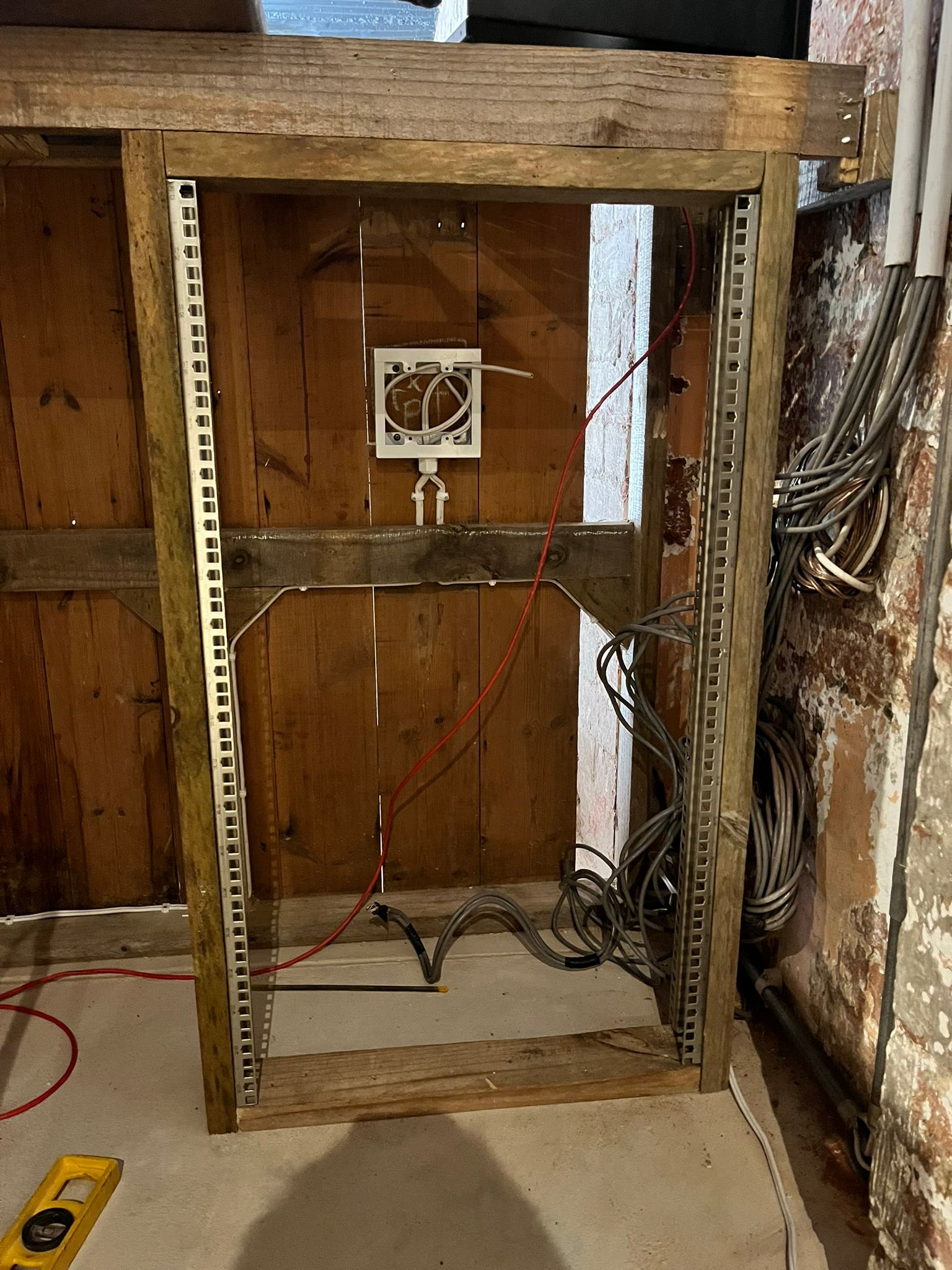 AV equipment rack built directly into the bar cabinetry