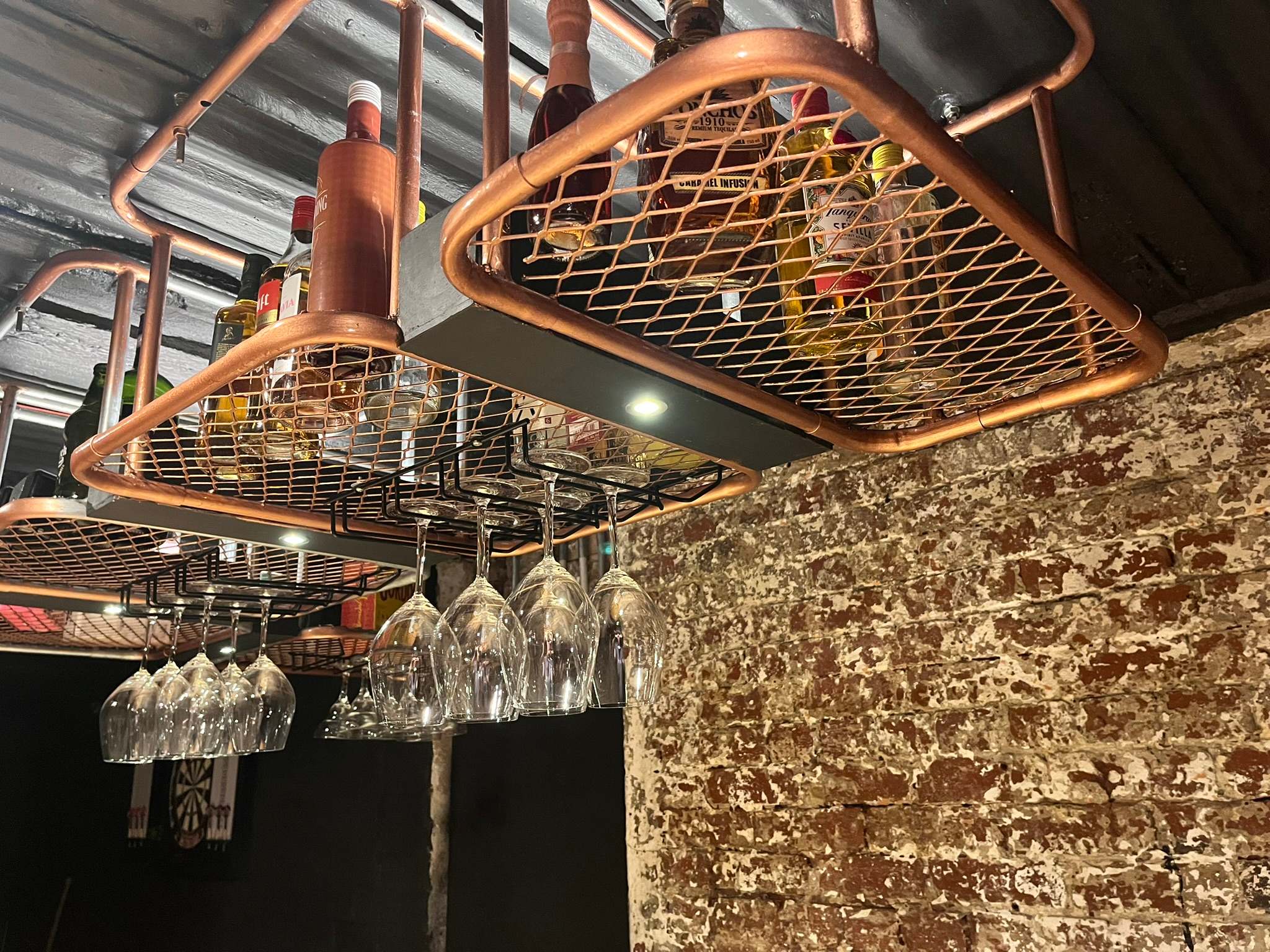 DG Technologies heritage entertainment room build detail: Gold Bronze Painted Glass Rack