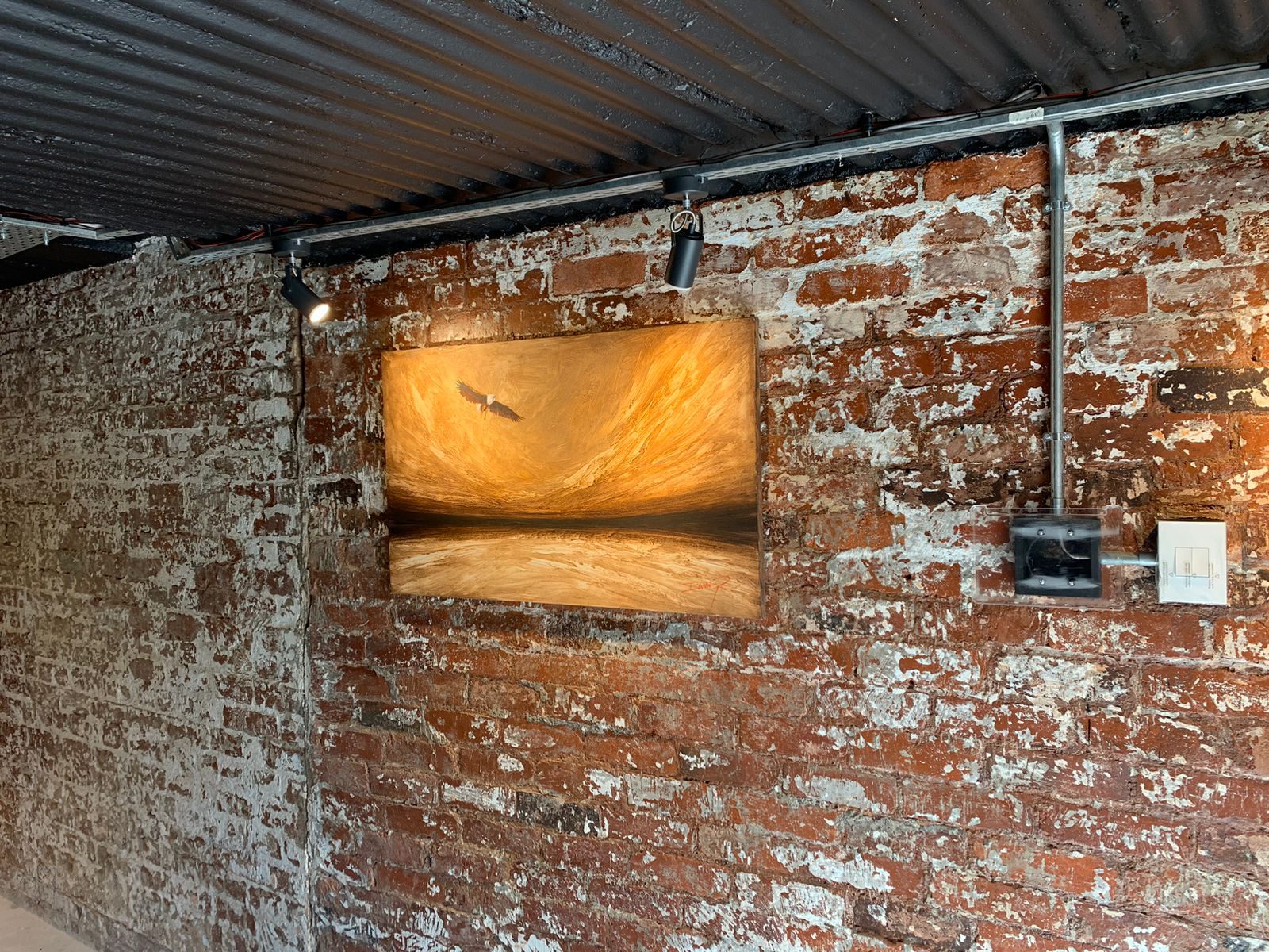 Invisible speaker hidden behind an artwork-style wall finish