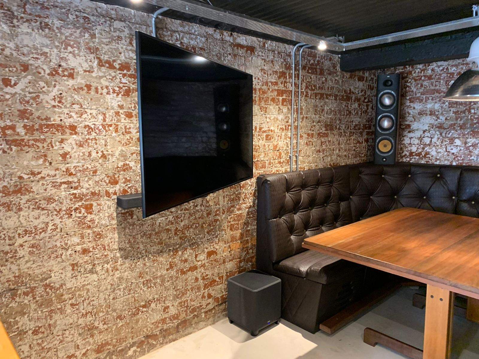 DG Technologies testing a motorised screen and display mechanism during an entertainment room build