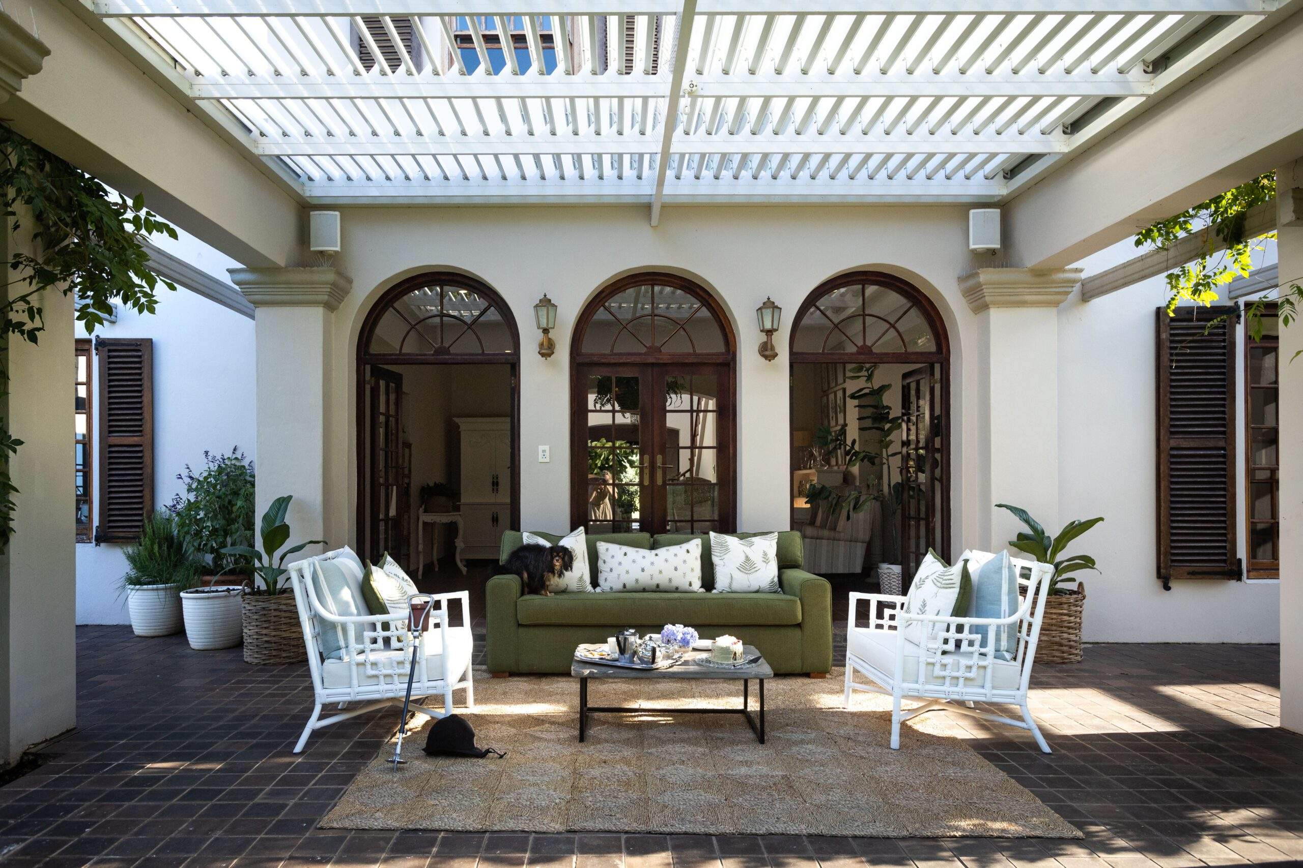 Outdoor entertainment area with weather-rated speakers