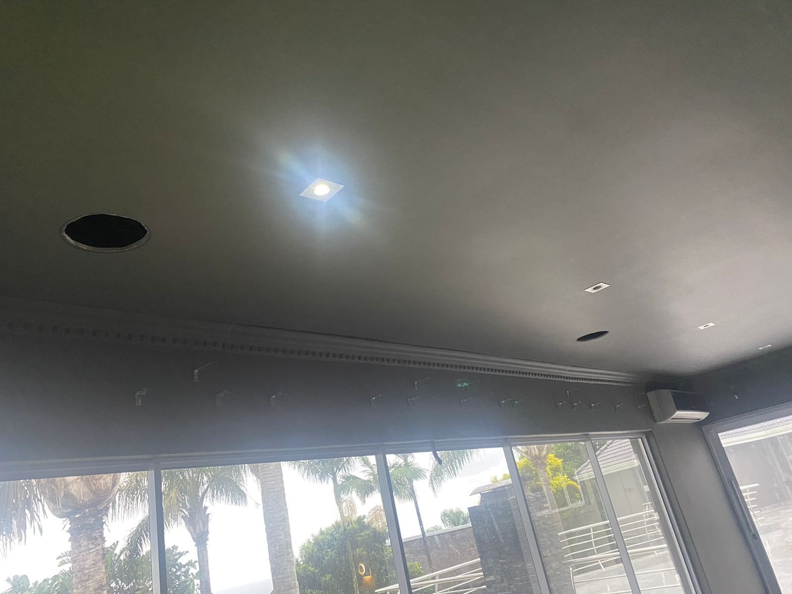 Rear speaker holes being cut during home cinema first fix