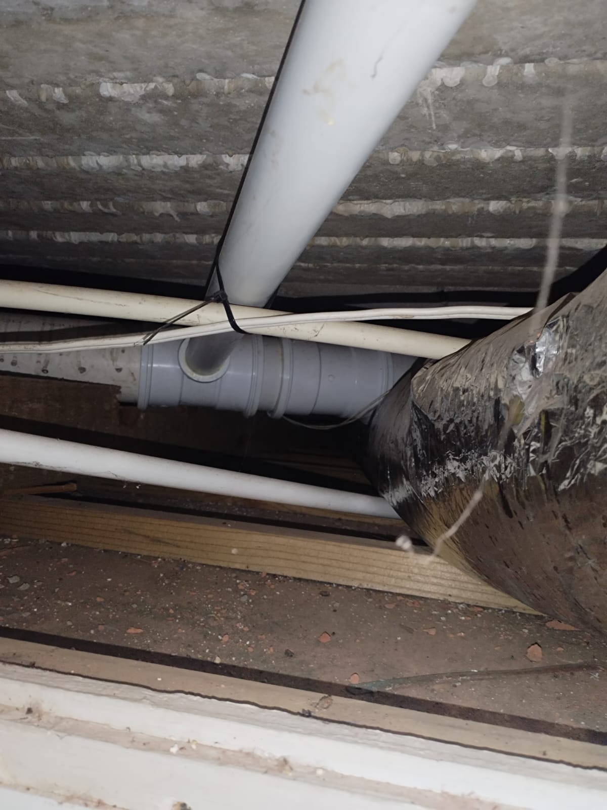 Low-voltage cable tied to a pipe during a service route inspection