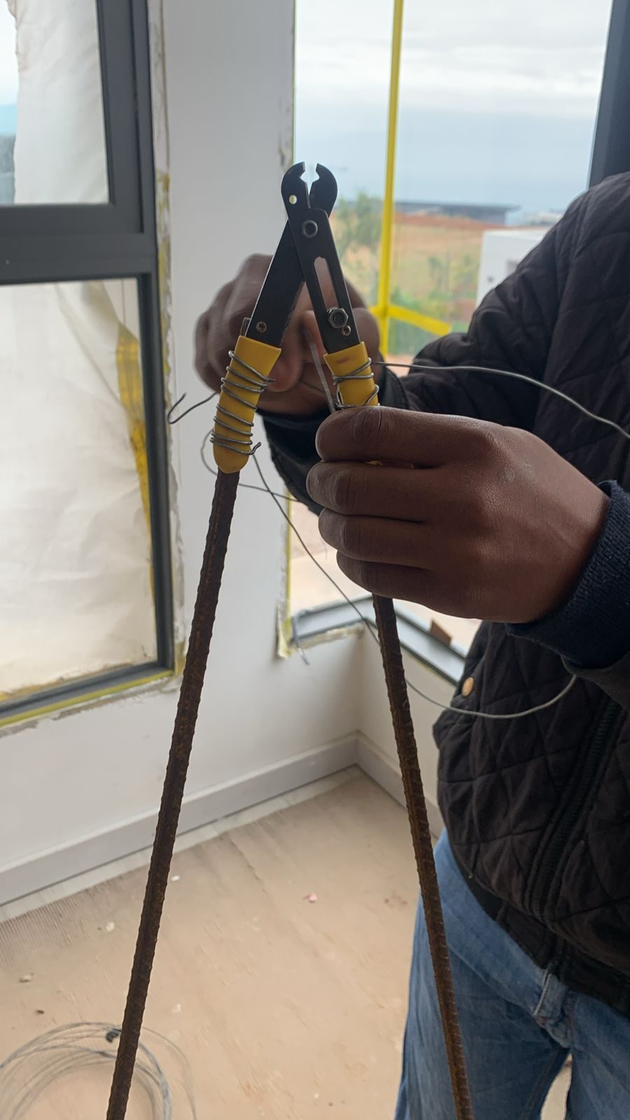 sakhi my technician making a plan with trying to cut a wire in the ceiling