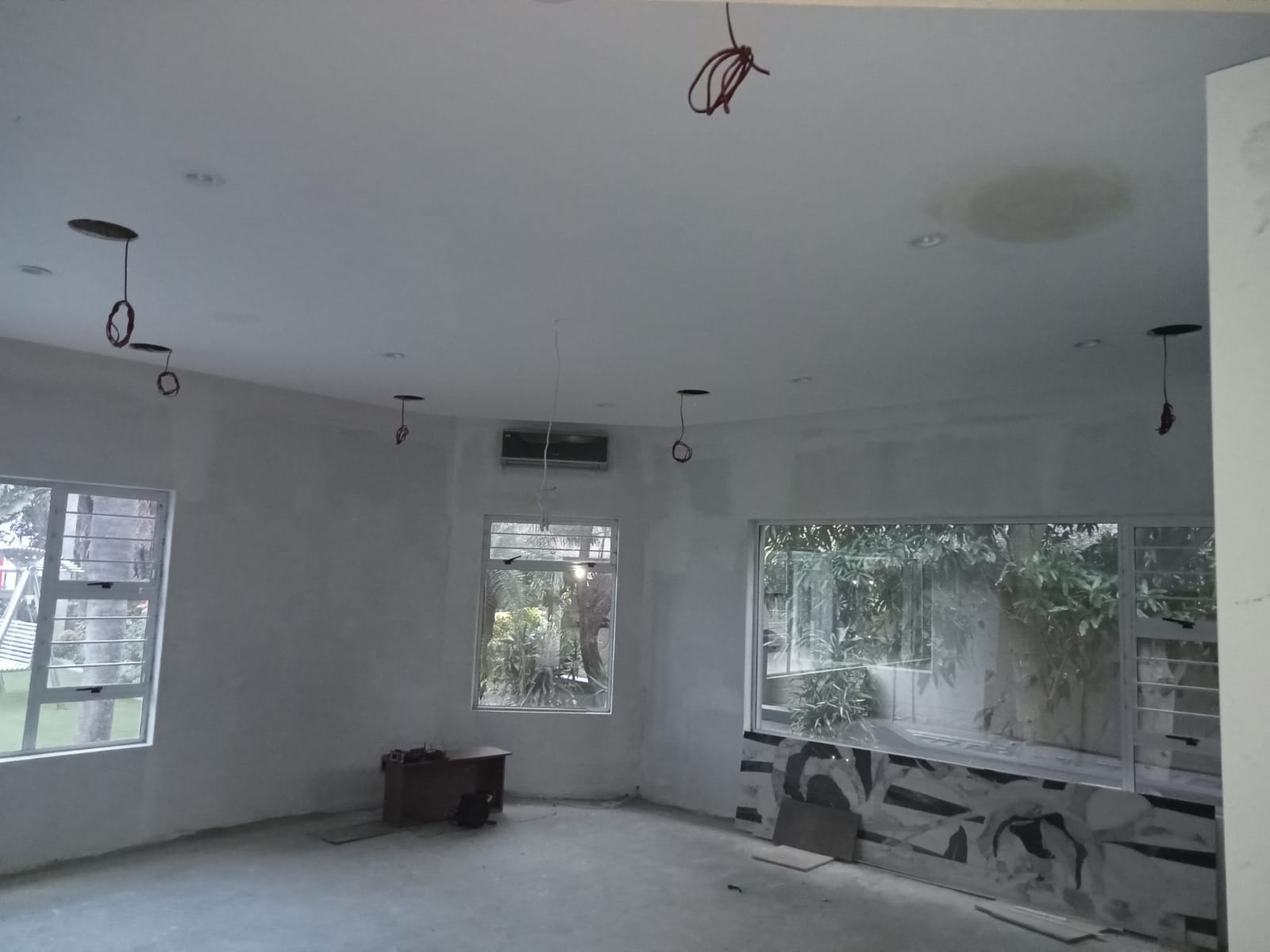 Ceiling speaker and downlight positions being coordinated during construction
