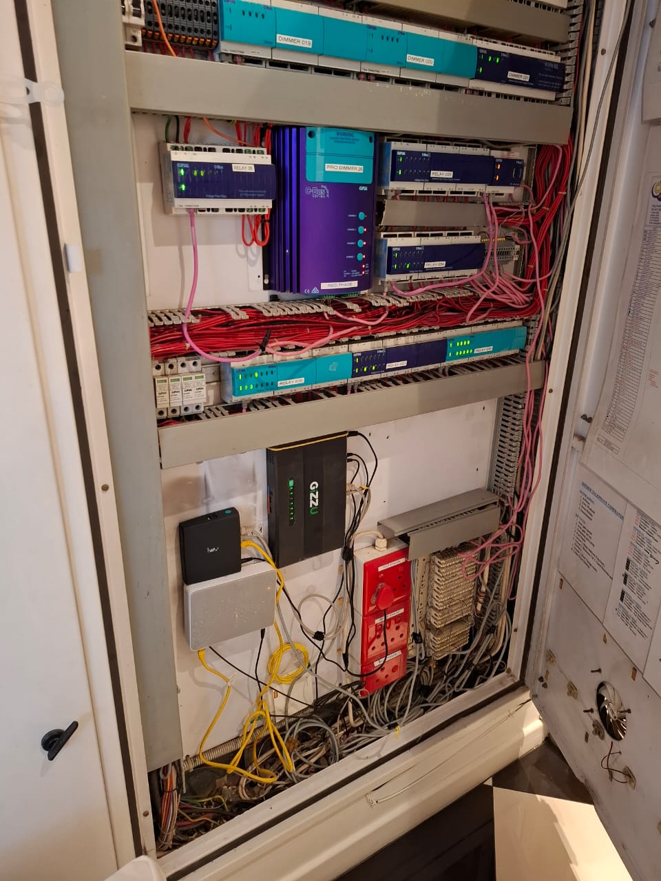 Legacy Crestron and automation cabinet found with messy cabling during assessment